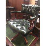 A green button leather swivel office chair Catalogue only, live bidding available via our website.