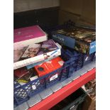 Two small blue crates of mixed small electricals, collectables, PS3 and Nintendo Wii games, etc
