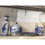 Two blue and white eastern style vases a large blue and white lidded jar and an Ironstone platter.