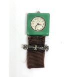 An Ollendorff silver and green enamel case lapel watch with signed 15 jewel manual wind movement