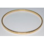 A hallmarked 9ct gold bangle, diam. 67mm, wt. 15.53g. Condition - very good, general wear only, no