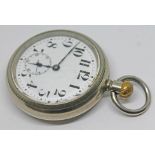 A Cyma open face pocket watch with large Arabic numerals on a white enamel dial and seconds