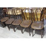 A group of five bentwood cafe style chairs. Condition: each with split to back panel and a couple