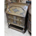 A 1920s carved oak bureau, width 78cm, depth 45cm & height 107cm. Condition: minor chips to feet,