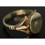 A hallmarked 9ct gold signet ring set with a diamond, gross wt. 2.98g, size N.