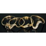 A group of four wishbone rings comprising two hallmarked 9ct gold and two others, size N/O, gross