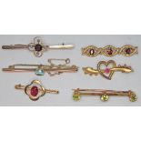 A group of six brooches set with paste, various 9ct marks, gross wt. 12.40g.