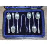 A cased set of hallmarked silver teaspoons and sugar tongs.