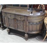A 1930s Jacobean style carved oak sideboard, length 165cm, depth 59cm & height 101cm. Condition: