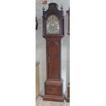A George III eight day mahogany long case clock, domed top with fret work and arched hood with brass
