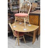 An Ercol blonde drop leaf table and two chairs. Condition - good, no dame/repairs, minor wear only