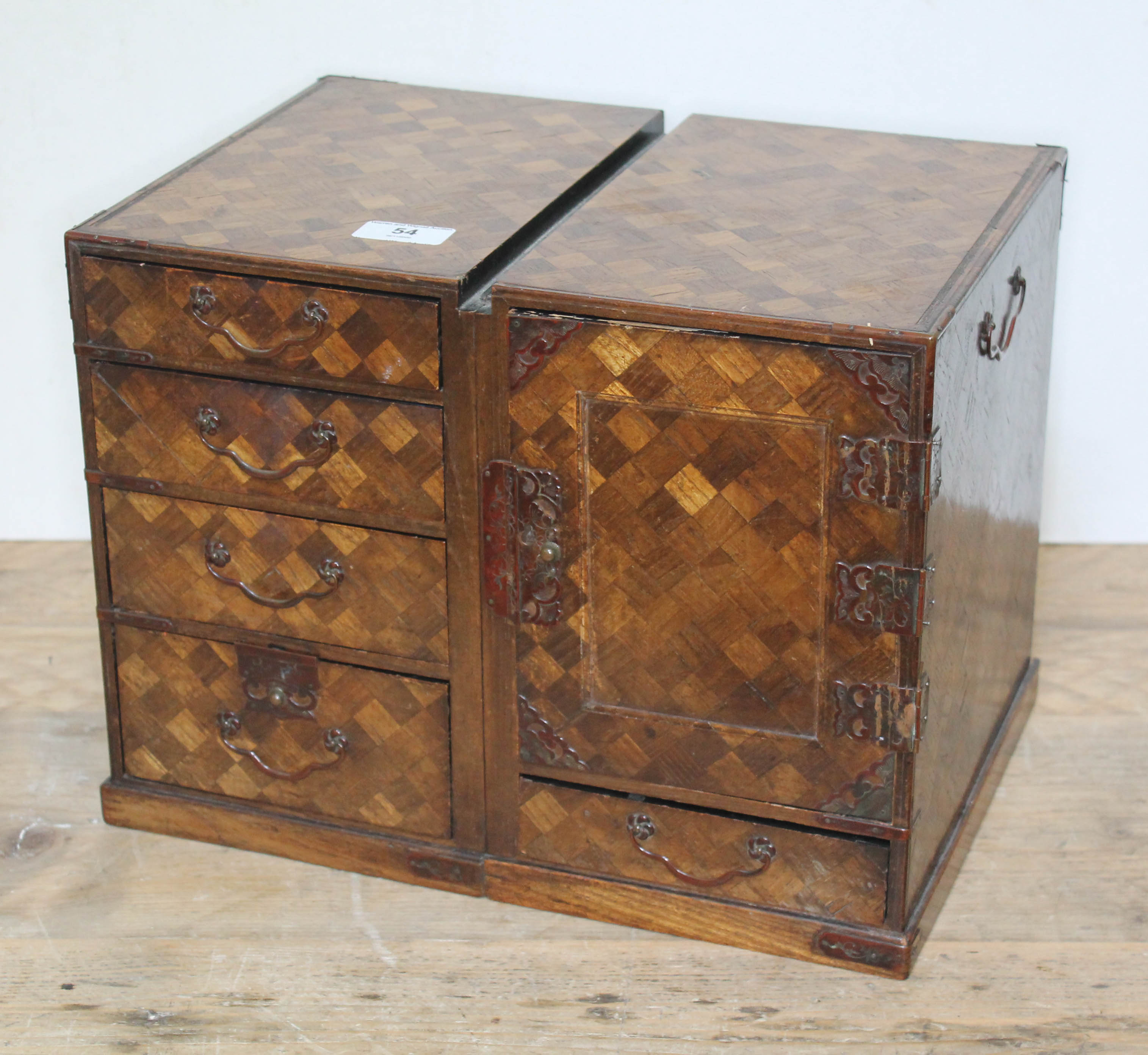 A Japanese parquetry and metal bound miniature cabinet, height 27.5cm, length 36cm, depth 25cm.