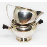 An Art Deco hallmarked silver sugar bowl and cream jug, gross wt. 6oz.