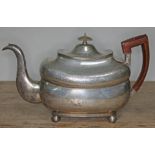 A George III Irish silver teapot, with wooden handle, horn finial, engraved, ball feet, maker's