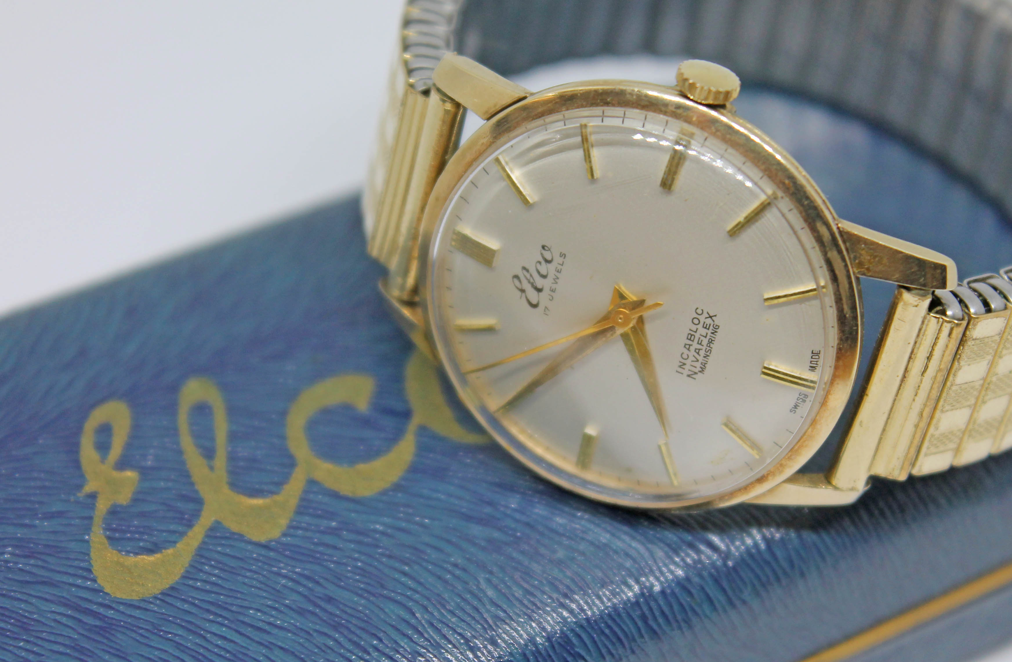 A 1960s hallmarked 9ct gold Elco wristwatch with signed champagne dial, gold tone hour markers and