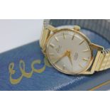 A 1960s hallmarked 9ct gold Elco wristwatch with signed champagne dial, gold tone hour markers and