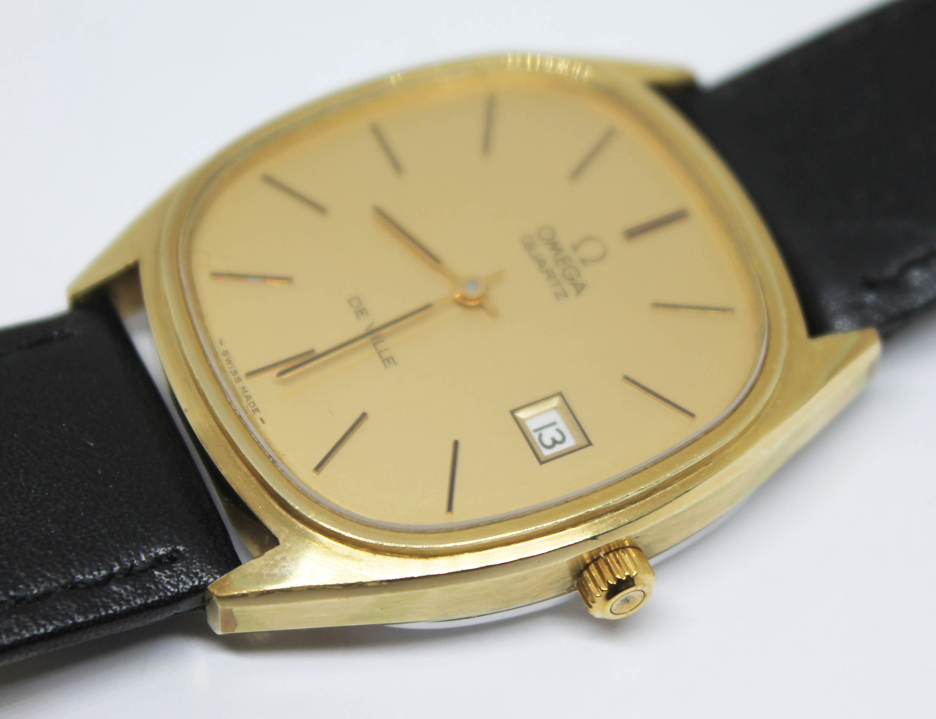 A 1977 gold plated Omega De Ville Quartz reference 192.0028, the gold tone signed dial having gold