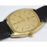 A 1977 gold plated Omega De Ville Quartz reference 192.0028, the gold tone signed dial having gold
