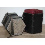 An early 20th century thirty three buttoned concertina with fretted steel ends and fitted box,
