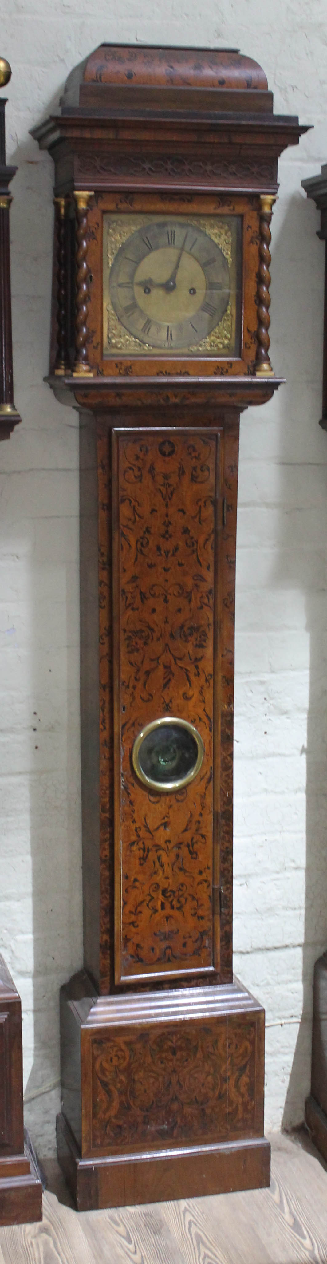 A William & Mary/Queen Anne eight day long case clock with arabesque marquetry inlaid case, hood