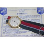 A vintage gold plated Oris wristwatch having signed dial with Roman numerals and baton hands in