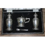 A cased three piece hallmarked silver cruet.