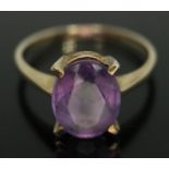 A hallmarked 9ct gold amethyst ring, the stone measuring approx. 10mm x 8mm x 3mm, gross wt. 2.