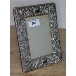 A late Victoria/Edwardian embossed silver photograph frame, Mappin & Webb, London 1901, 15cm x 19cm.