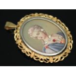 A portrait brooch, length 40mm, the loop marked '750' with UK import marks, gross wt. 6.04g.
