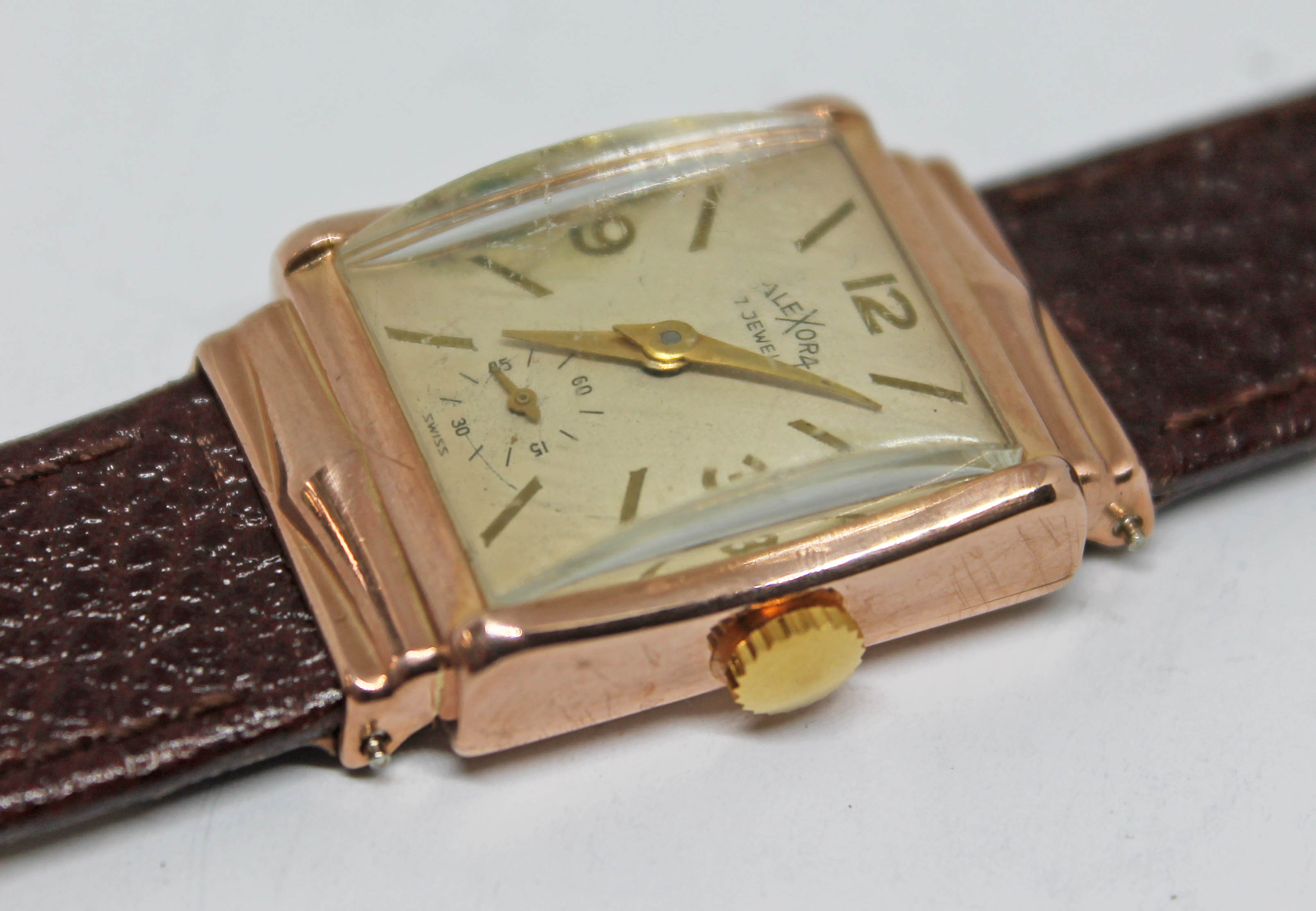 A vintage 14k gold Emerson Watch Co art deco style wristwatch, the dial signed Alexora with hands,