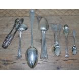 A mixed lot of silver flat ware including a basting spoon London 1901, three desert spoons London