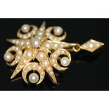 An antique pearl pendant formed from two five point stars interspersed with crescents, diam. 24mm,