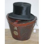 A Tress & Co silk top hat, retailed by Rufus Sanderson, Leeds, with red velvet lined lockable