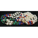 A three strand multi-gemstone necklace set with cultured pearls, malachite, lapis lazuli and coral