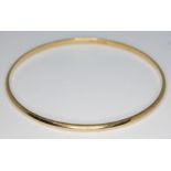 A hallmarked 9ct gold bangle, diam. 65mm, wt. 10.83g. Condition - good, no damage/repair, minor