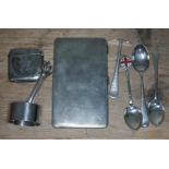 A mixed lot of hallmarked silver comprising an Art Deco cigarette case, a vesta case, a serviette