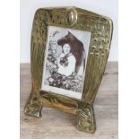 An Edwardian brass photoframe designed with peacocks, height 25cm.