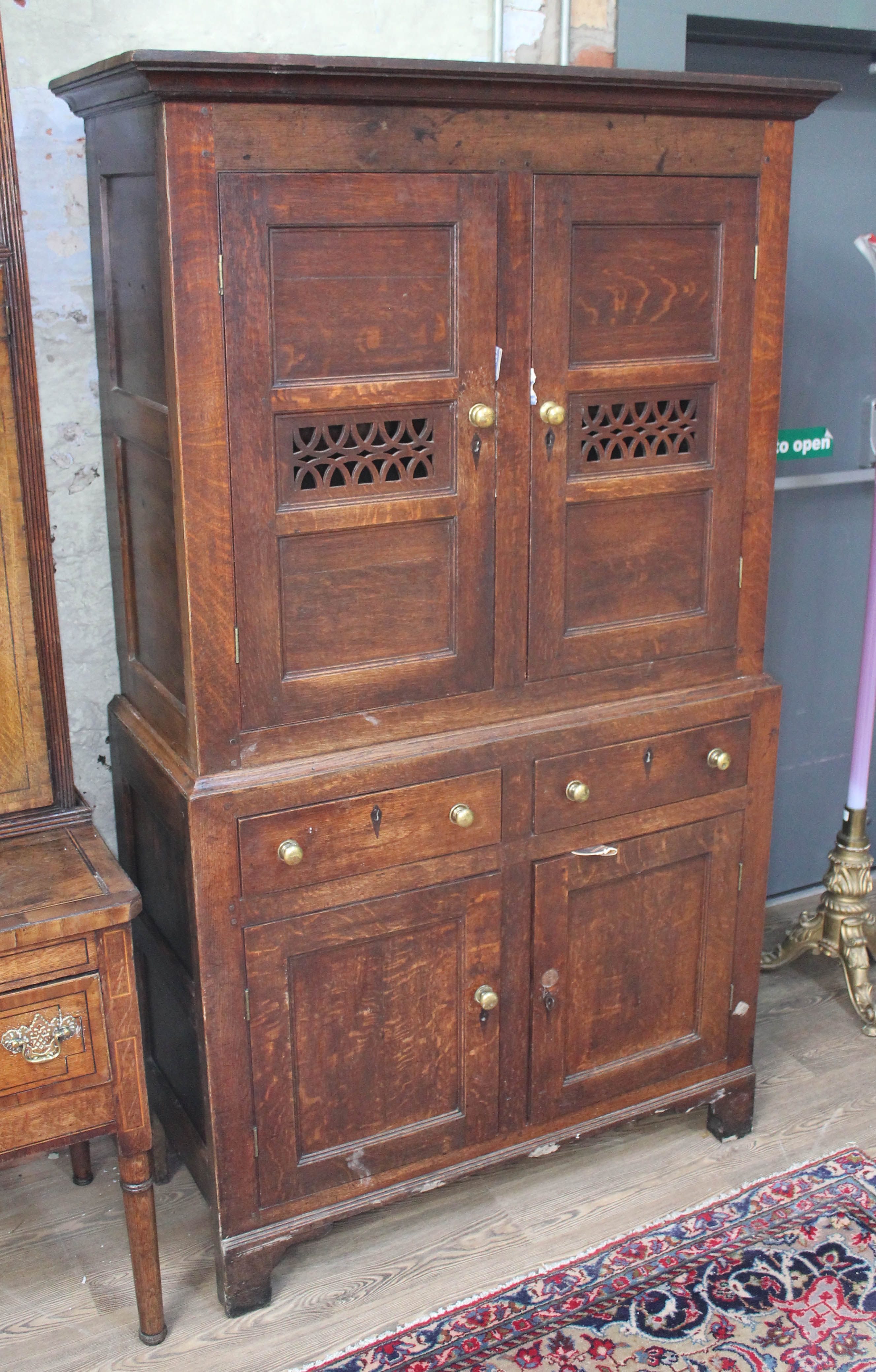 An 18th century and later oak cabinet, width 107cm, depth 47cm & height 190cm. Condition: general