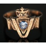 A Victoria commemorative(?) ring formed as a crowned 'V' with central round cut sapphire, band