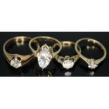 A group of four rings comprising two hallmarked 9ct gold and two others marked '375', each set