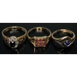 A group of three hallmarked 9ct gold rings, one set with diamonds around a central sapphire, gross