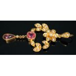 An Edwardian drop pendant set with seed pearls and amethysts, length 47mm, marked '15ct', gross