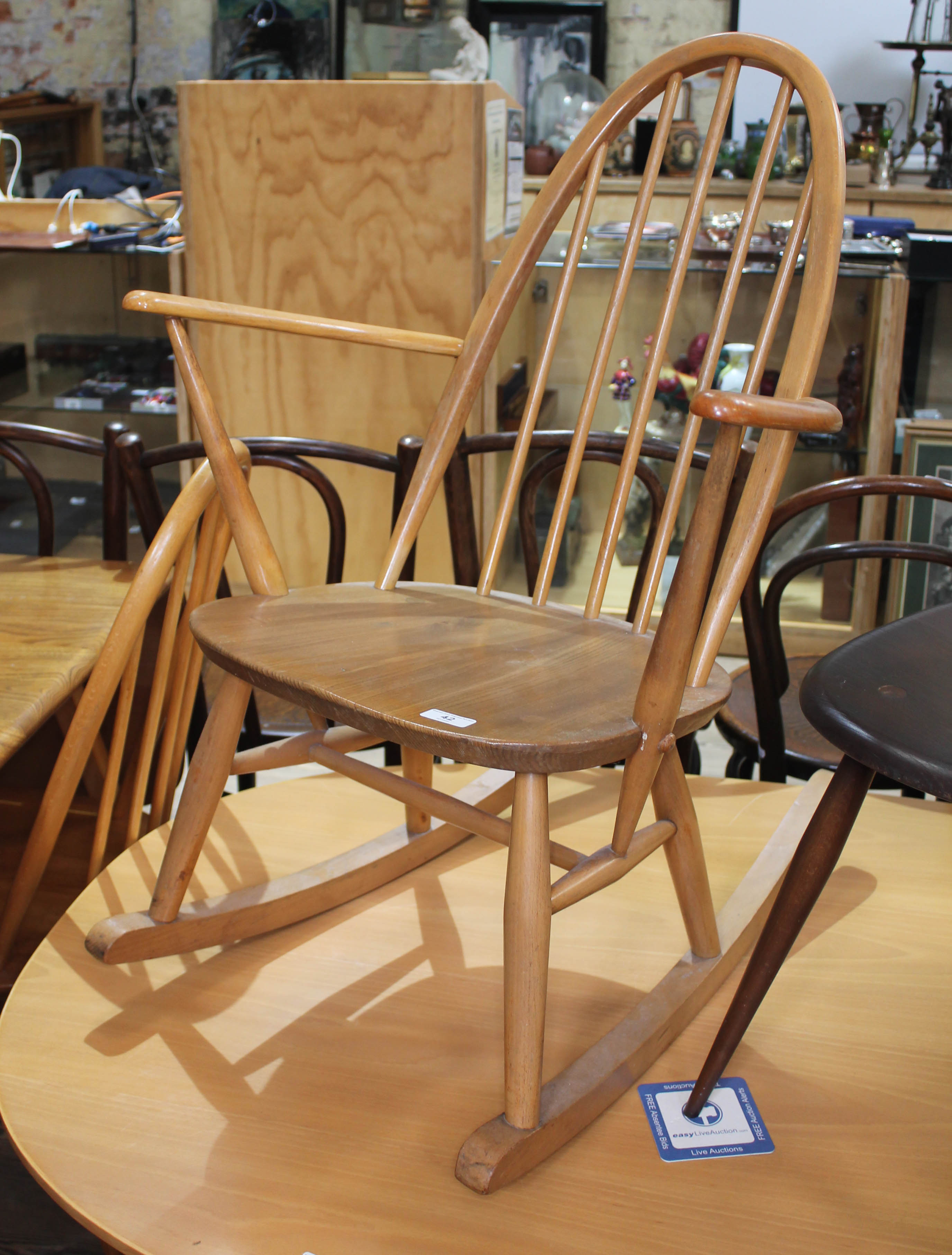 An Ercol blonde elm and beech rocking chair, height 84cm. Condition - good, appears damage/repair