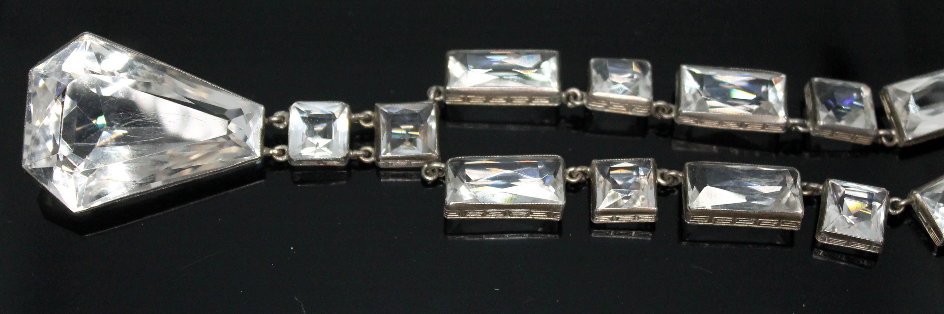 An Art Deco quartz rock crystal necklace, length 42cm, drop length 54mm, marked 'Sterling'.