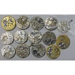 A collection of 14 pocket watch movements, some with dials and crowns, including a Birks 'Broker',