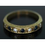 A hallmarked 18ct gold diamond and sapphire half eternity ring, gross wt. 3.03g, size K. Condition -