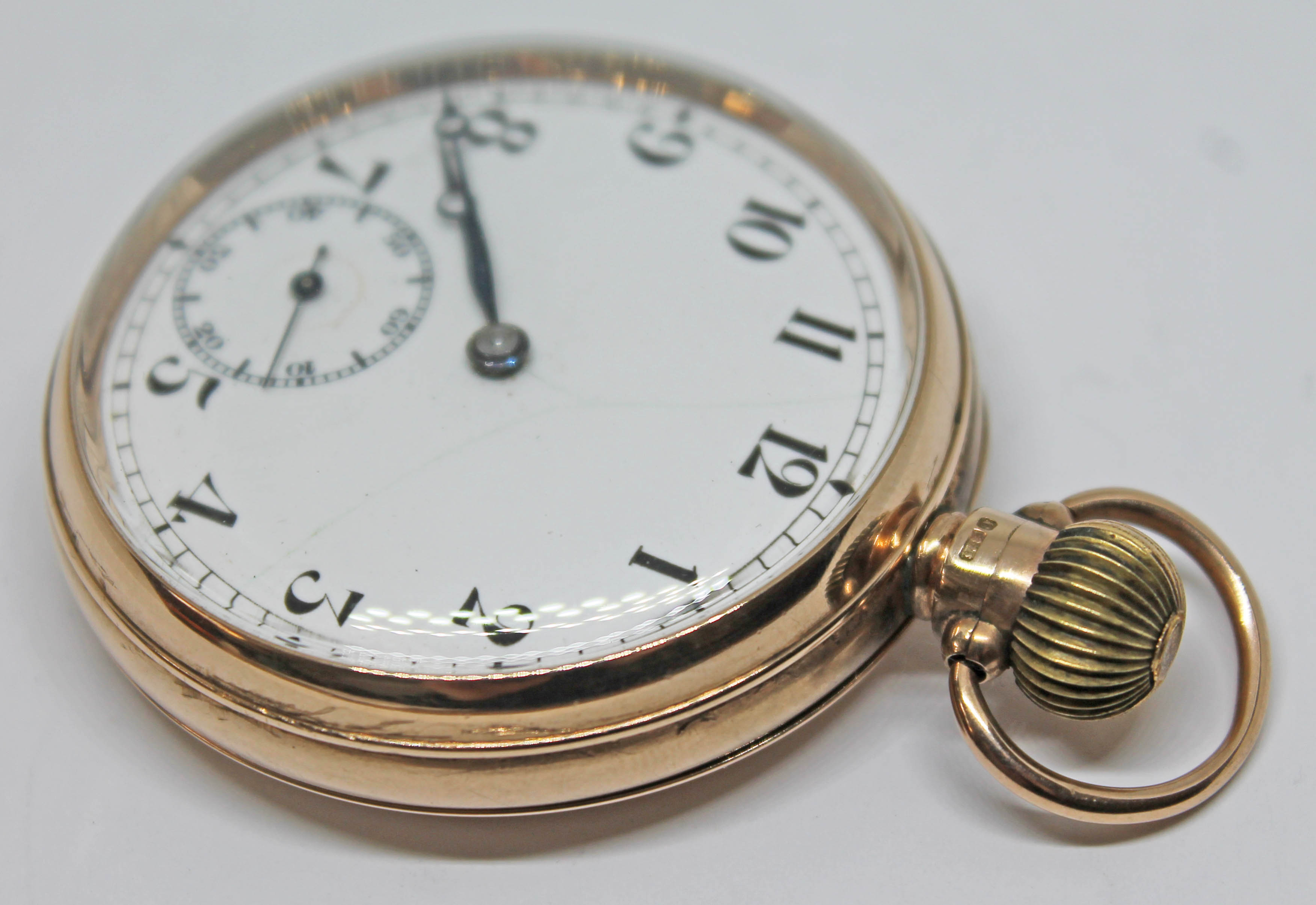 A hallmarked 9ct gold Record pocket watch, with unsigned white enamel dial, Arabic numerals, breguet