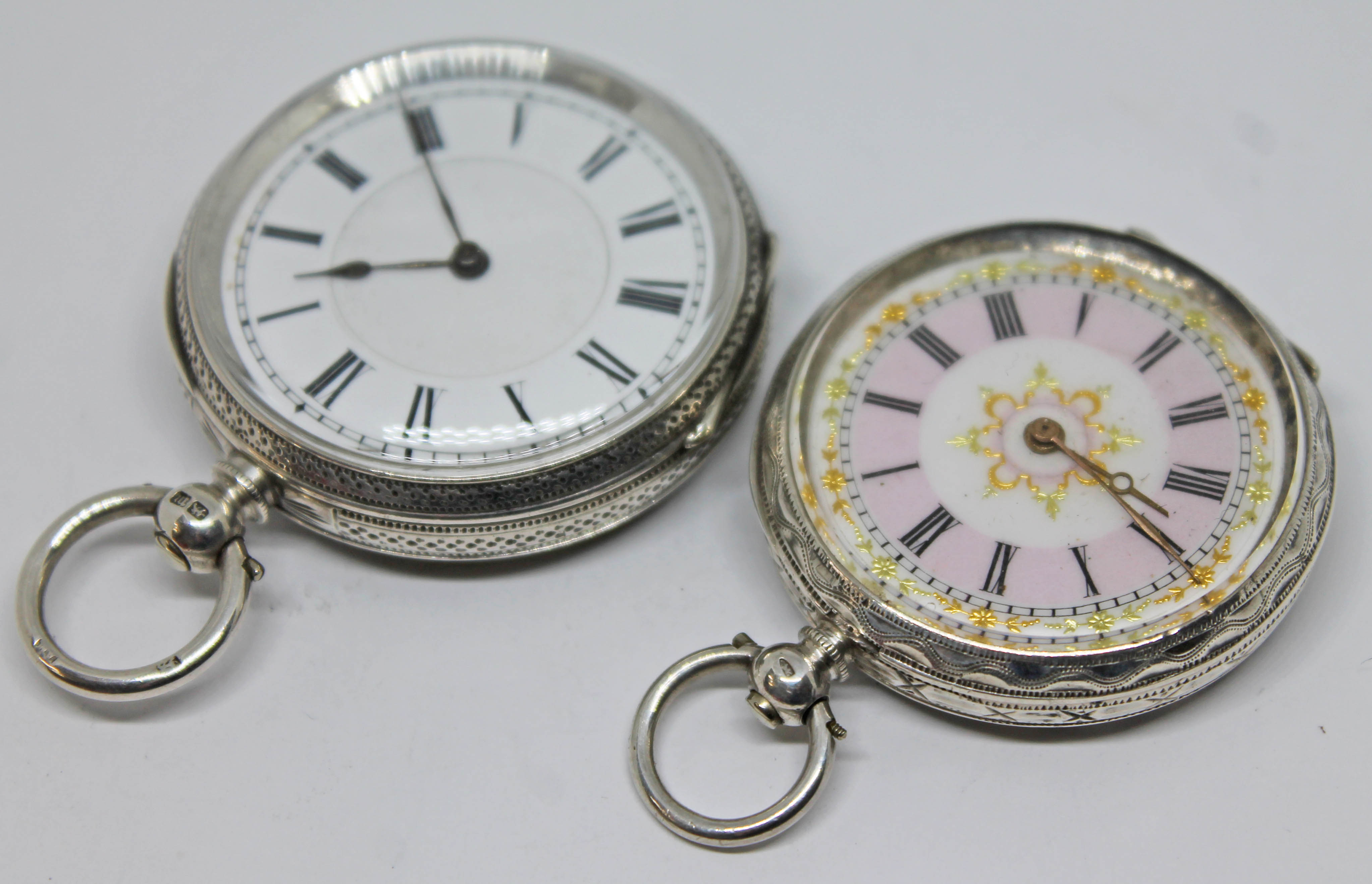 Two ornately engraved ladies Victorian silver pocket watches, one hallmarked silver, the other