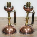 A pair of Arts & Crafts copper and brass candlesticks, manner of Christopher Dresser/Benham & Froud,