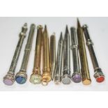 Ten assorted propelling pencils including one hallmarked silver and another inscribed 'J Rigby